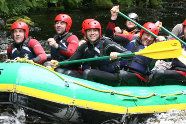 White Water rafting stag group on River Rhondda, Wales