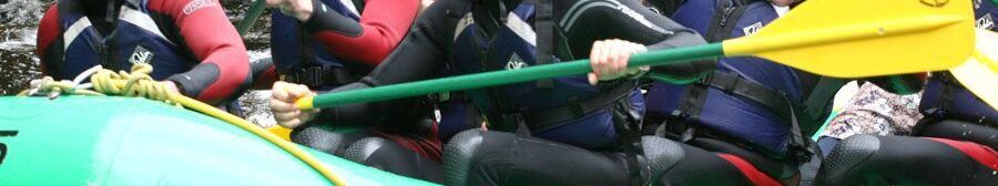 White Water rafting stag group on River Rhondda, Wales