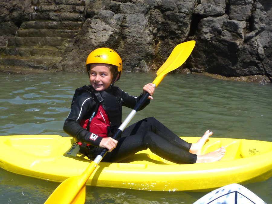 Child Surf Kayaking with Adventures Wales