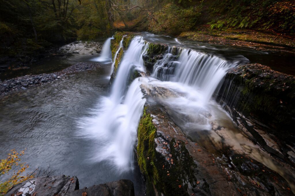 Walking along the Panwar Or Sgwd Y Pannwr On The Lower Clun-gwyn Waterfall