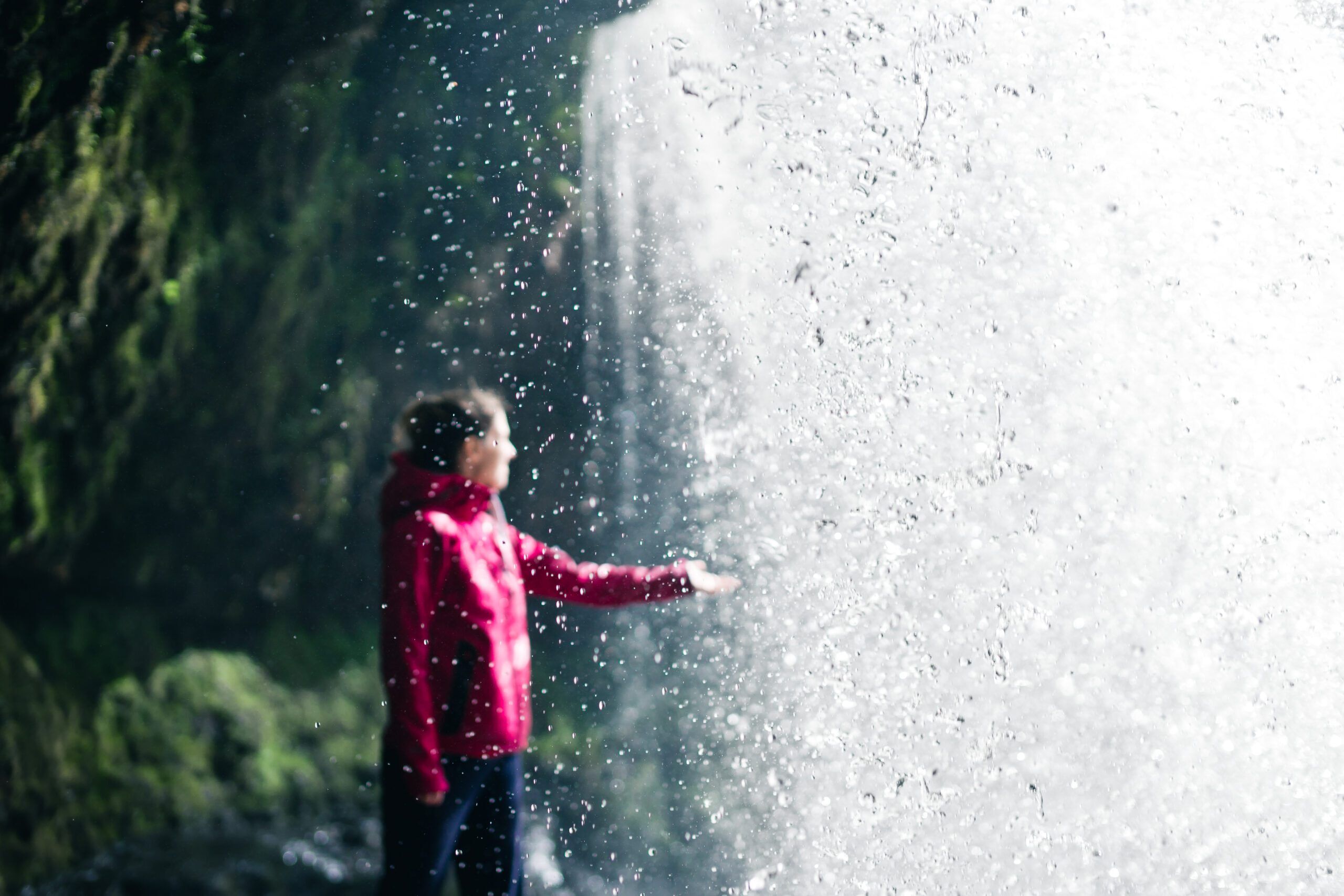 Female,Hiker,,Tourist,,Model,Out,Of,Focus,Touching,Water,Under 4 waterfalls walk
