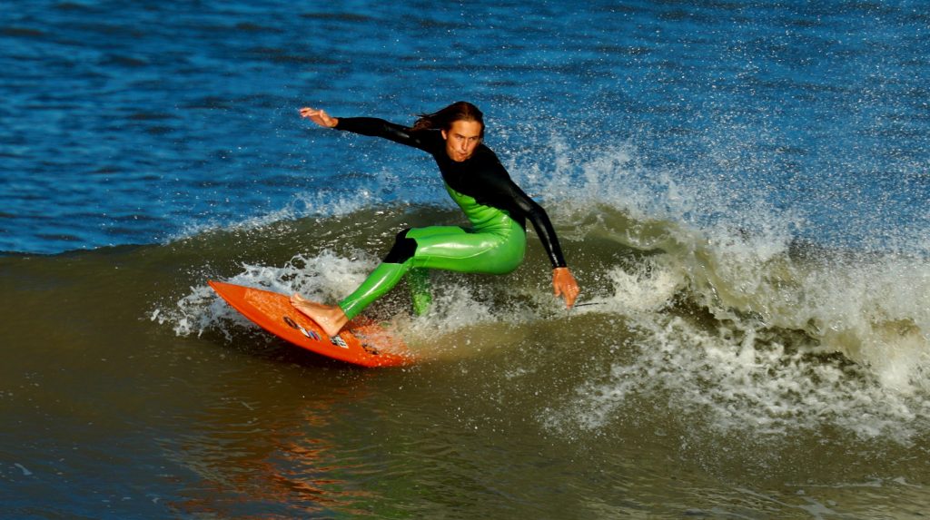 'Blakey' performing a cut back surfing move at Rest Bay, Porthcawl