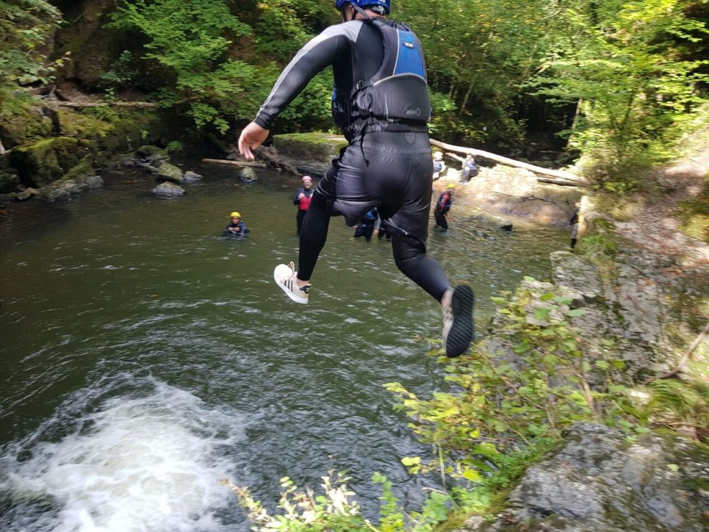Cliff jump on a Canyoning outdoor pursuits day